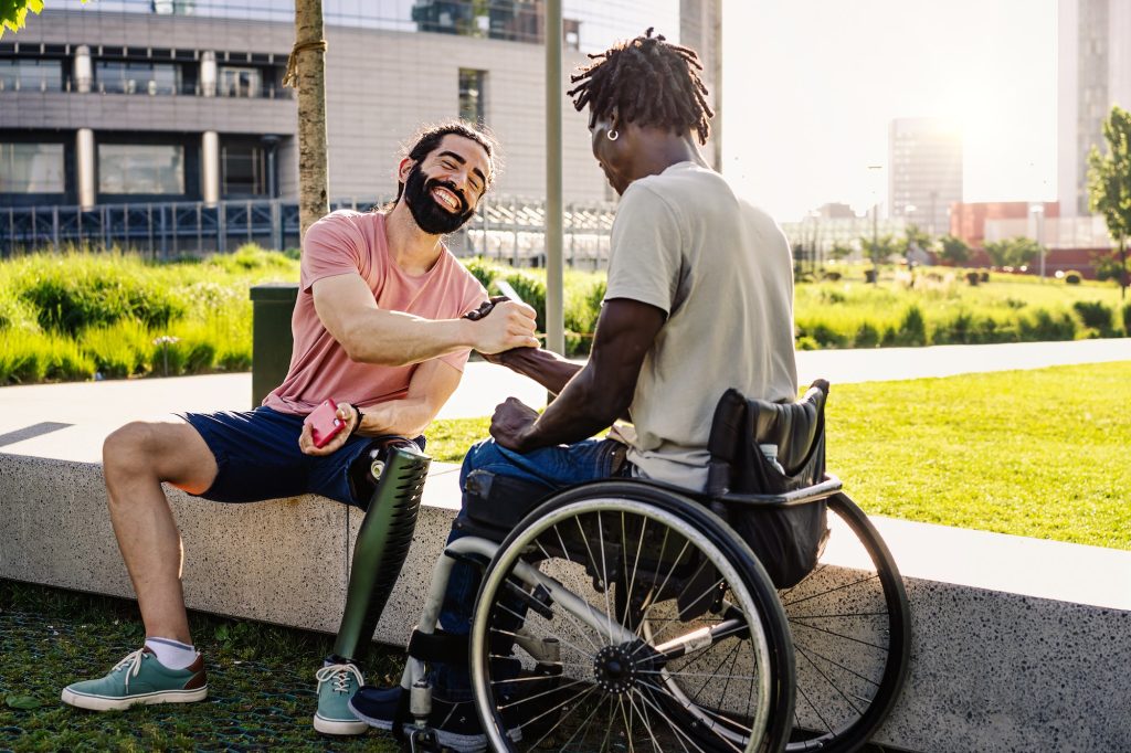 Friends with disabilities shaking hands