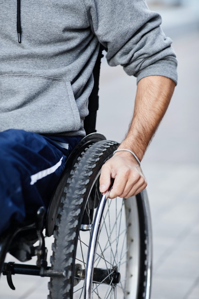 Man with disability sitting in wheelchair