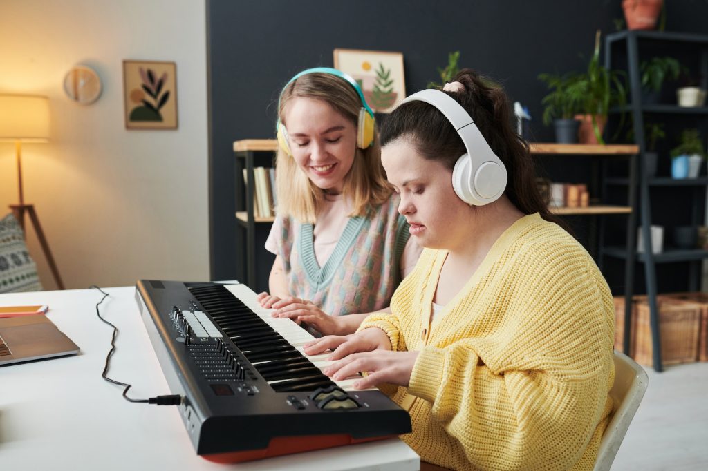 Music Teacher And Student With Disability
