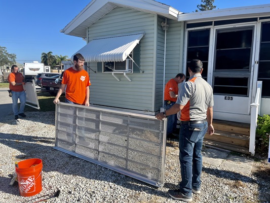 Home Depot team setting up ramp outside veterans home.